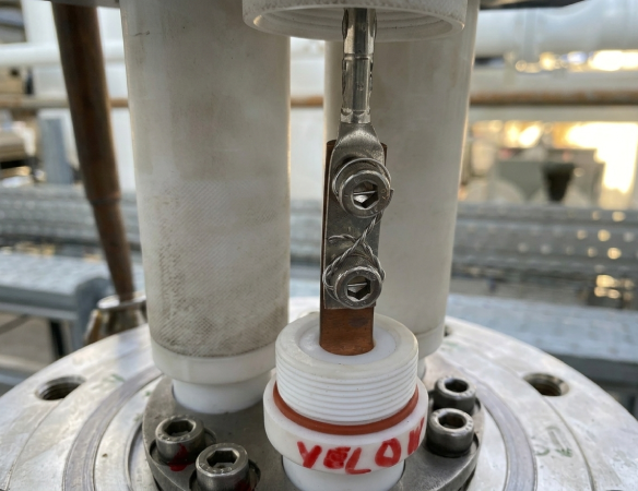 Safety-wired hex bolts on an electrical copper terminal